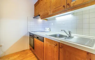 a kitchen with a sink and a stove at 1 Bedroom Gorgeous Apartment In Pohorje in Pohorje