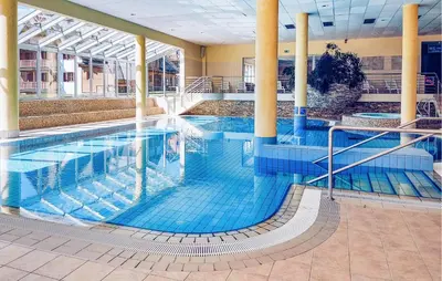 a large swimming pool in a building at Awesome Apartment In Pohorje in Pohorje