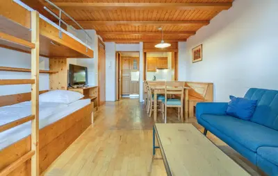 a living room with a bunk bed and a couch at Awesome Apartment In Pohorje in Pohorje