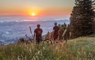 two men standing on top of a hill at sunset at Awesome Apartment In Pohorje in Pohorje