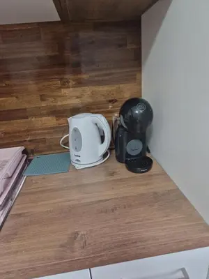 a toaster sitting on top of a kitchen counter at apartma-sobe Lejla in Vipava