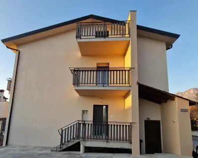 a building with balconies on the side of it at apartma-sobe Lejla in Vipava