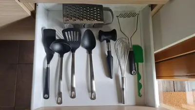 a bunch of utensils hanging on a wall at Apartma Pikabooth in Topolšica