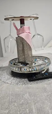 a high heel shoe on a table with two glasses at CILT in Kranj