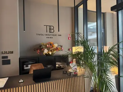 an office with a desk with a laptop on it at Tivoli Boutique Inn in Ljubljana