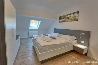 a bedroom with a bed in a room at Terme Olimia - Apartment 407 in Podčetrtek