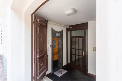 an entrance to a hallway with a door and a window at Apartments Perla in Krško