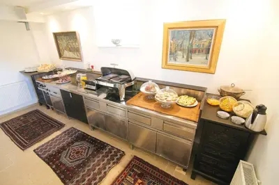 a kitchen with a counter with some food on it at Budget dbl Studio free breakfast in Ljubljana