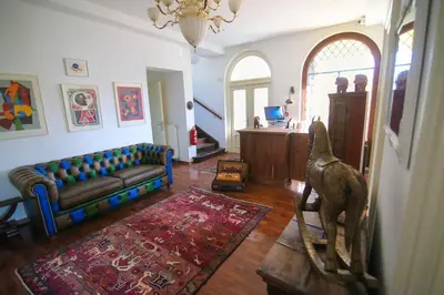a living room with a couch and a dog statue at Budget dbl Studio free breakfast in Ljubljana