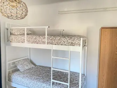 a bedroom with two bunk beds in a room at Apartment Herberstainova in Ljubljana
