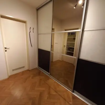 an empty room with a glass door and a hallway at Apartment Blue Moon in Ljubljana