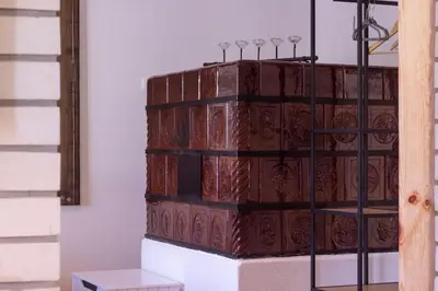 a stack of books sitting on a shelf at Garden apartment No.3 in Bled