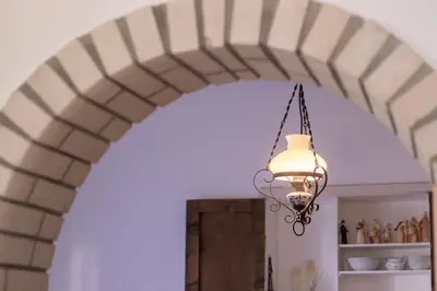 an archway in a kitchen with a light fixture at Garden apartment No.3 in Bled