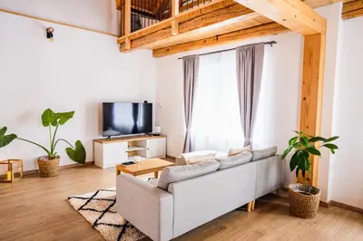 a living room with a couch and a tv at Pri stari mami in Tomaž pri Ormožu