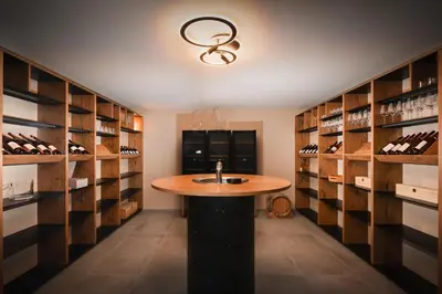 a wine tasting room with a round table in the middle at Green Valley Apartments in Zavrč
