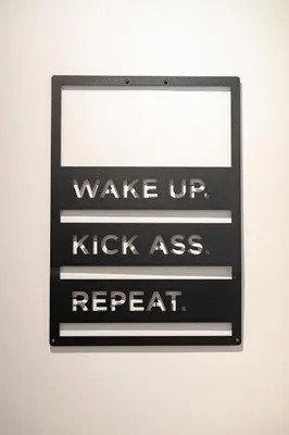 a sign that reads wake up kick ass repeat at Waterfall Apartment - Cozy Mountain Retreat in Kranjska Gora