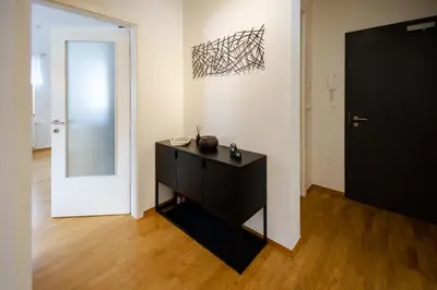a room with a black cabinet and a black door at Waterfall Apartment - Cozy Mountain Retreat in Kranjska Gora