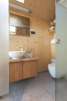 a bathroom with a sink and a toilet at Glamping house Julija - Wellness & View in Ivanjkovci