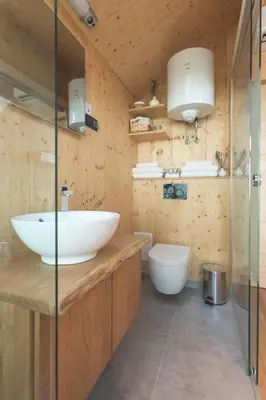 a bathroom with a white sink and a toilet at Glamping house Julija - Wellness & View in Ivanjkovci
