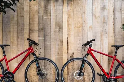 three bikes parked next to a wooden fence at Glamping house Julija - Wellness & View in Ivanjkovci