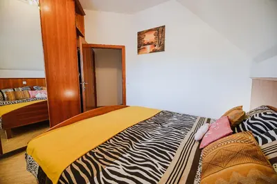 a bedroom with a zebra blanket on a bed at Holiday Home Oxi in Čatež ob Savi