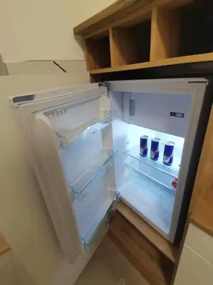 an empty refrigerator with its door open in a kitchen at Grajski kamen apartment in Maribor