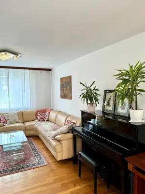 a living room with a piano and a couch at Central Villa with Garden in Ljubljana