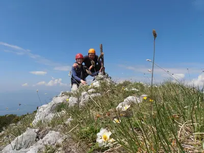 two people standing on top of a mountain at Bed & Breakfast Base Camp in Križe