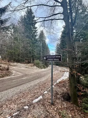 a street sign on the side of a road at Foxi apartment, Pohorje in Pohorje