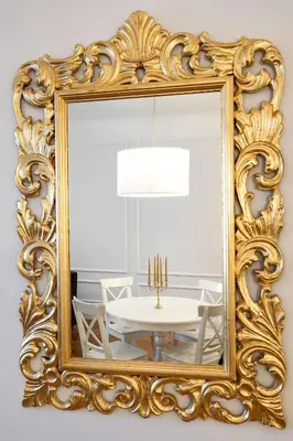 a dining room mirror with a white table and chairs at MARIANNA'S OLD TOWN RESIDENCE in Ljubljana