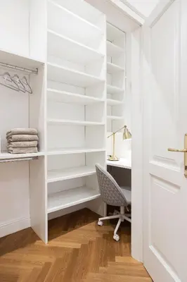 a walk in closet with a desk and a chair at MARIANNA'S OLD TOWN RESIDENCE in Ljubljana