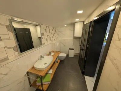 a bathroom with a sink and a toilet at TOMO 2 in Postojna