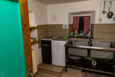 a kitchen with a sink and a stove at Home Puščava in Kranj