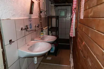 a bathroom with two sinks in a room at Home Puščava in Kranj