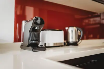 a coffee maker sitting on top of a kitchen counter at Cozy Nest in quiet neighbourhood, free parking in Ljubljana