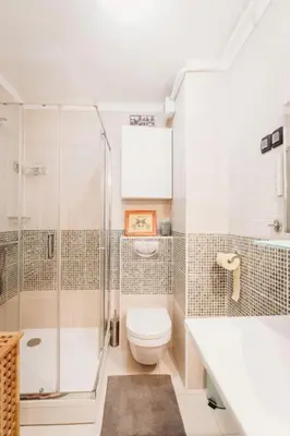 a bathroom with a shower and a toilet and a sink at Cozy Nest in quiet neighbourhood, free parking in Ljubljana