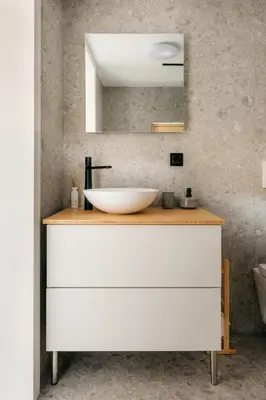 a bathroom with a sink and a mirror at Cozy A-Frame Retreat Near Ljubljana With Hot Tub in Cerklje na Gorenjskem