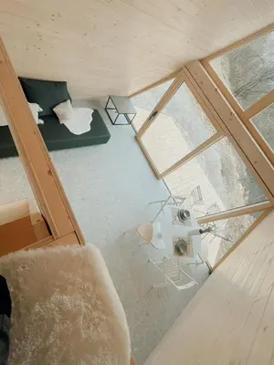 an overhead view of a bedroom in a house at Cozy A-Frame Retreat Near Ljubljana With Hot Tub in Cerklje na Gorenjskem
