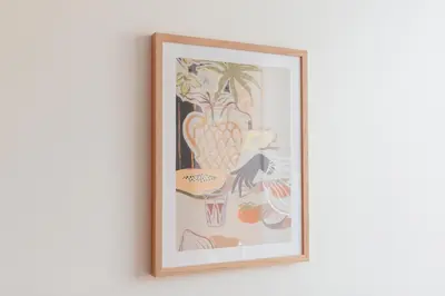 a framed picture of fruit on a wall at Luxury 2 bedroom NEW apartment with private parking in Ljubljana