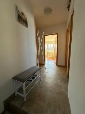 a hallway with a bench in a room at Vanessa Apartment in Ljubljana