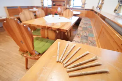 a wooden table with knives on top of it at Guest house Vila Korošec in Bovec