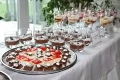 a table with cupcakes and a cake on a table at Guesthouse Kaučič in Benedikt v Slovenskih Goricah