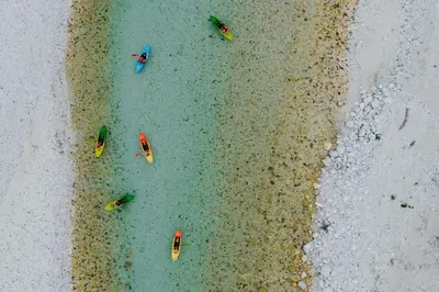 an aerial view of boats in the water near the beach at Apartma Gojsa in Bovec