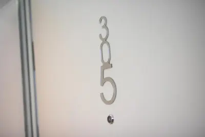 a door with a number five hanging on it at Apartment Silver Deer, Kranjska Gora in Kranjska Gora