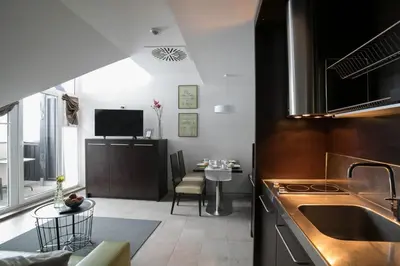 a kitchen with a sink and a table at Apartment Silver Deer, Kranjska Gora in Kranjska Gora