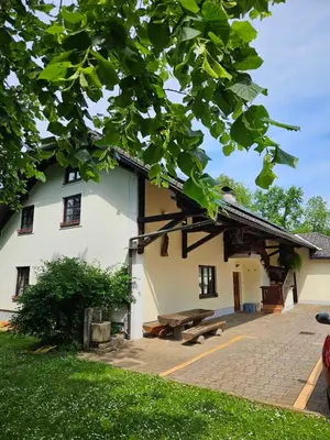 a building with a picnic table in front of it at Župnijski apartmaji in Dolenjske Toplice