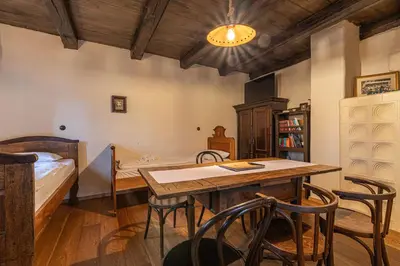a room with a bed and a table and chairs at Goricko Natural Chalets in Križevci