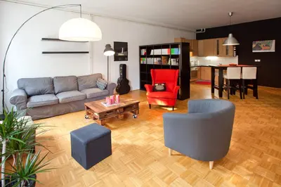 a living room with a couch and chairs and a table at Apartment REZIDENCA GOGA in Novo Mesto