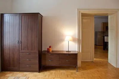 a room with a dresser and a lamp on a cabinet at Apartment REZIDENCA GOGA in Novo Mesto