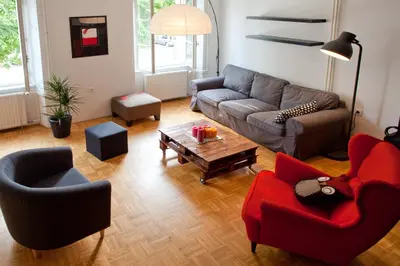 a living room with a couch and a table at Apartment REZIDENCA GOGA in Novo Mesto